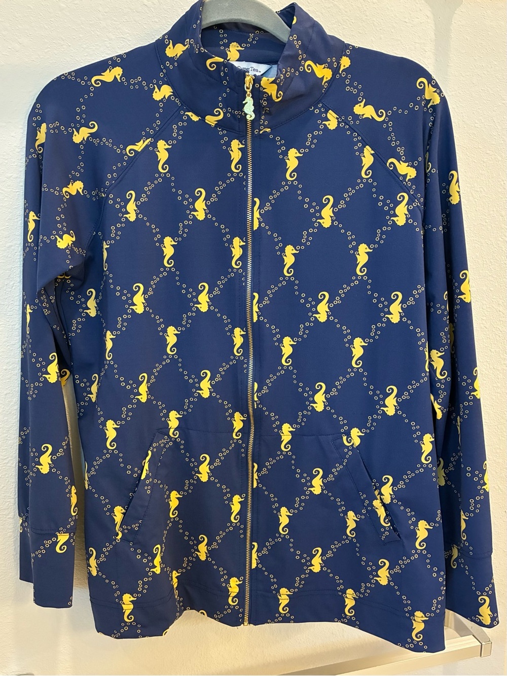 Navy zip jacket with seahorse theme Size  Medium. NWOT Never worn, UV safe